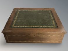 An inlaid mahogany writing box with tooled leather top