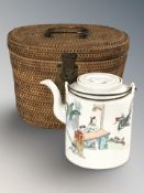 A late 19th century Chinese export porcelain tea pot depicting ladies in a garden observing a