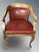 An early 20th century beech armchair with studded red leather seat