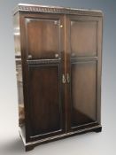 An early 20th century mahogany double door wardrobe,