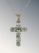 A 9ct gold blue topaz crucifix pendant, length 3cm,