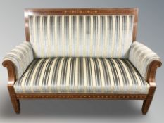 An early 20th century continental mahogany and satinwood inlaid salon settee,