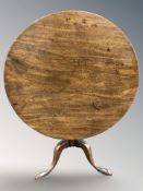 A George III mahogany snap top tripod table on pad feet,