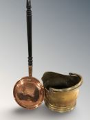 A brass swing handled coal bucket and a copper bed warming pan.