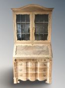A Danish blond oak and leaded glass bookcase,