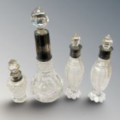Four Victorian silver mounted perfume and other bottles