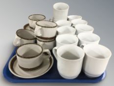 Eleven Royal Copenhagen mugs and eleven further Danish pottery mugs and saucers.