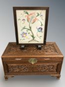 An oriental heavily carved blanket chest,