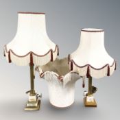 Two similar gilt brass and onyx columnar table lamps, with shades, plus two further spare shades,