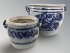 Two continental glazed blue and white stoneware planters, tallest 25 cm.