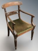 A William IV carved mahogany desk armchair,