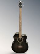 A Vintage electro acoustic bass guitar,