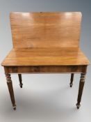 A 19th century mahogany turnover top tea table,