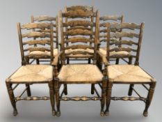 A set of six reproduction elm farmhouse ladder back dining chairs with rush seats