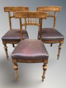 A set of three 19th century continental burr walnut dining chairs.