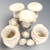 A pair of concrete staddle stones, an octagonal bird bath, pair of sack planters,