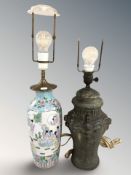 An oriental porcelain lamp base and a further pottery lamp base with lion mask decoration,