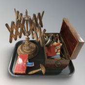 A beech wall winder, a darning mushroom, a sarcophagus caddy containing assorted sewing items,