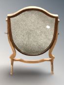 A mahogany shield shaped swing dressing table mirror, height 60 cm.