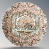 A fine Japanese Meiji or Taisho-period porcelain charger, depicting a street vendor's flower cart,