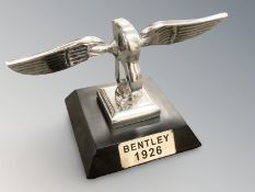 A reproduction Bentley car mascot, width 21 cm.