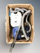 Two Nilfisk vacuum cleaners.