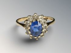 A 9ct yellow gold cluster ring set with synthetic stones, size P.