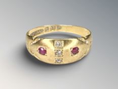 An antique 18ct yellow gold ring set with two small rubies and three diamonds, size J.