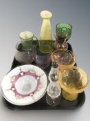A group of coloured glass vessels including a uranium glass pitcher, pair of crystal sifters.