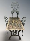 A weathered teak and painted metal garden patio table, length 122 cm,