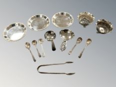A set of three silver pin dishes, seven various caddy spoons, pair of salts,