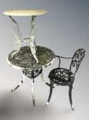 A painted metal circular garden patio table, diameter 74 cm, a smaller table,