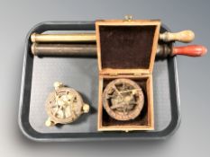 Two vintage garden sprayers and two reproduction brass compasses with sun dials.