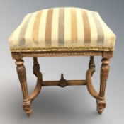 A 19th century French carved walnut stool,