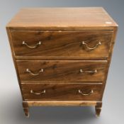 A 20th century stained pine three drawer low chest, width 49 cm.