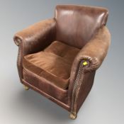 A 20th century studded brown leather armchair,