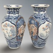 A pair of 19th century Japanese Imari blue and white porcelain baluster vases, height 23 cm.