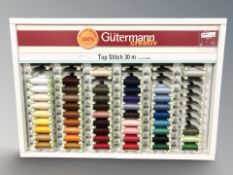 A Gütermann Creativ thread spool counter top stand, 55 cm x 28 cm x 38 cm.
