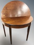 A 19th century mahogany demi-lune tea table,