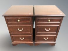 A pair of reproduction bedside chests,
