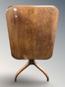 A mahogany tilt top occasional table
