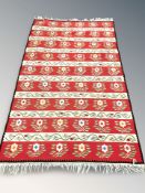An eastern flatweave kilim, 260 cm x 152 cm.