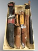 A group of hunting and other knives, cutthroat razor in box.
