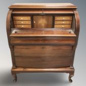 A 20th century continental mahogany cylinder bureau, 94 cm W x 50 cm D x 110 cm H.