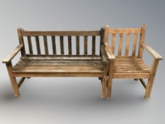 A weathered teak garden bench,