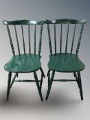 A pair of painted spindleback chairs.