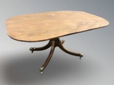 A George III rectangular mahogany pedestal dining table,