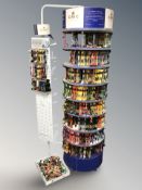 A Dollfus Mieg & Cie rotating haberdashery shop circular display stand on castors,