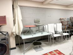 A metal glass topped garden patio table, with parasol, 153 cm x 96 cm x 69 cm,