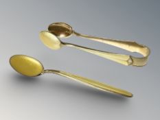 A pair of David Andersen Norwegian silver gilt and enameled sugar tongs, and similar teaspoon.